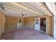 A spacious two-car garage features brick flooring and access to the main house with utility hookups at 1108 Gibson St, Leesburg, FL 34748