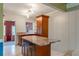 Open kitchen with island offering ample counter space, great for entertaining at 1108 Gibson St, Leesburg, FL 34748