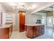 Spacious kitchen boasts an island with marble countertop and custom cabinets at 1108 Gibson St, Leesburg, FL 34748