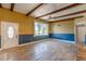 Welcoming living room with large windows and a front door access at 1108 Gibson St, Leesburg, FL 34748