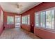 Sun room featuring brick flooring, windows, and access to the exterior at 1108 Gibson St, Leesburg, FL 34748