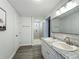 Modern bathroom featuring a double vanity with granite countertop and a walk-in shower at 1118 Ne 17Th Ave, Ocala, FL 34470