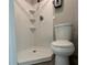 Modern bathroom featuring a shower, commode, and clean design, offering both functionality and style at 1118 Ne 17Th Ave, Ocala, FL 34470