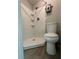 Bathroom with shower, a toilet, and an electric water heater at 1118 Ne 17Th Ave, Ocala, FL 34470