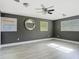 Spacious bedroom with a ceiling fan, multiple windows, and neutral wall color at 1118 Ne 17Th Ave, Ocala, FL 34470