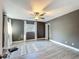 Spacious bedroom with a ceiling fan, natural light, and wood-look flooring at 1118 Ne 17Th Ave, Ocala, FL 34470