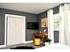 Bedroom featuring a mounted TV, decor, and a closet for ample storage at 1118 Ne 17Th Ave, Ocala, FL 34470