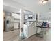 Bright open concept featuring the kitchen with stainless steel appliances and a connected eating area at 1118 Ne 17Th Ave, Ocala, FL 34470