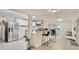 Bright, airy kitchen featuring stainless steel appliances, a breakfast bar, and an open layout to the living area at 1118 Ne 17Th Ave, Ocala, FL 34470