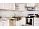 Modern kitchen with white cabinets, granite countertops, stainless steel appliances, and open shelving at 1118 Ne 17Th Ave, Ocala, FL 34470