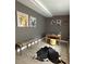 Modern living room featuring a bench, desk, and modern art pieces at 1118 Ne 17Th Ave, Ocala, FL 34470