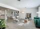 Spacious living room featuring stylish seating, wood-look floors, and an open layout at 1118 Ne 17Th Ave, Ocala, FL 34470