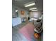 Bright living space with grey walls, laminate floors, modern rug, and eclectic decor at 1118 Ne 17Th Ave, Ocala, FL 34470
