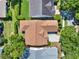 Birds eye view of the home surrounded by mature trees and a well manicured landscape at 112 Overton Gardens Lane, Deland, FL 32724