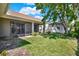 Spacious backyard with well-maintained lawn and screened in lanai at 112 Overton Gardens Lane, Deland, FL 32724
