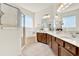 This bathroom boasts a glass-enclosed shower, separate tub and wood cabinets at 112 Overton Gardens Lane, Deland, FL 32724