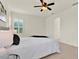 Comfortable bedroom with plantation shutters offering privacy and natural light at 112 Overton Gardens Lane, Deland, FL 32724