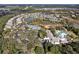 Aerial view of the community clubhouse showcasing tennis courts and pool at 112 Overton Gardens Lane, Deland, FL 32724