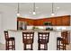 Open kitchen features a breakfast bar with pendant lighting and stainless steel appliances at 112 Overton Gardens Lane, Deland, FL 32724