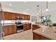 Spacious kitchen with modern stainless steel appliances and rich wood cabinetry at 112 Overton Gardens Lane, Deland, FL 32724