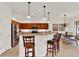 Well-equipped kitchen with wooden cabinetry, granite countertops, and stainless steel appliances at 112 Overton Gardens Lane, Deland, FL 32724