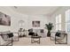 Cozy living room with neutral tones, decorative artwork, and ample natural light at 112 Overton Gardens Lane, Deland, FL 32724