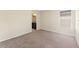 Spacious bedroom with carpet, natural light from the window, and an en-suite bathroom entrance at 11386 Biography Way, Orlando, FL 32832