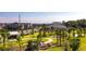 Scenic community park with lush landscaping, walking paths, and recreational facilities at 11386 Biography Way, Orlando, FL 32832