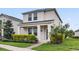 Inviting two-story home with a lush front yard and charming curb appeal at 11386 Biography Way, Orlando, FL 32832