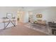 Cozy living room featuring neutral walls, carpet flooring, stylish furniture, and a decorative rug at 11386 Biography Way, Orlando, FL 32832