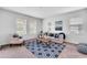 Bright living room featuring stylish furniture, area rug, and plenty of natural light for a comfortable setting at 11386 Biography Way, Orlando, FL 32832