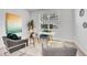 Bright home office featuring a glass desk and neutral decor at 11386 Biography Way, Orlando, FL 32832