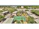 An aerial view of the community's buildings and adjacent tennis courts at 115 Oyster Bay Cir # 260, Altamonte Springs, FL 32701