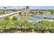Condominiums overlooking a serene lake with a walking bridge, ideal for relaxation at 115 Oyster Bay Cir # 260, Altamonte Springs, FL 32701