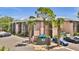 Condominium exterior featuring lush landscaping, a well-maintained building, and parking at 115 Oyster Bay Cir # 260, Altamonte Springs, FL 32701