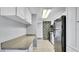 Kitchen features stainless steel appliances, granite countertops, and white cabinets at 115 Oyster Bay Cir # 260, Altamonte Springs, FL 32701