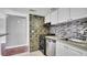 Modern kitchen with tiled backsplash, stainless steel appliances, and stylish cabinets at 115 Oyster Bay Cir # 260, Altamonte Springs, FL 32701