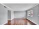Spacious living room featuring wood floors, natural light, and neutral paint at 115 Oyster Bay Cir # 260, Altamonte Springs, FL 32701