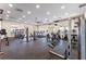 Large fitness center with an array of modern equipment, ceiling fan, and windows for natural light at 1315 Lawndale Cp, Ormond Beach, FL 32174