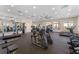 Spacious fitness center equipped with cardio machines, weightlifting stations, and mirrored walls at 1315 Lawndale Cp, Ormond Beach, FL 32174