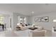 Comfortable living room with neutral decor, tile flooring, and lots of natural light, great for relaxing at 1315 Lawndale Cp, Ormond Beach, FL 32174