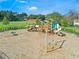 Community playground featuring swings, slides, and climbing structures for children at 1315 Lawndale Cp, Ormond Beach, FL 32174