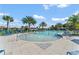 Resort-style community pool with palm trees, lounge chairs, and plenty of space at 1315 Lawndale Cp, Ormond Beach, FL 32174