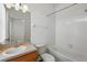 Bathroom with tub, sink, and oak cabinets at 13329 Harbor Shore Ln, Winter Garden, FL 34787