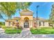 Well-maintained clubhouse with stately columns, large windows, and manicured landscaping providing an inviting gathering spot at 13329 Harbor Shore Ln, Winter Garden, FL 34787
