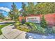 The Daniel's Landing community sign is surrounded by lush landscaping and brick pillars, welcoming residents and visitors at 13329 Harbor Shore Ln, Winter Garden, FL 34787