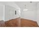 Open dining space with hardwood floors, leading to the stairway at 13329 Harbor Shore Ln, Winter Garden, FL 34787
