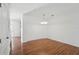 Bright dining area featuring hardwood floors and modern light fixture at 13329 Harbor Shore Ln, Winter Garden, FL 34787