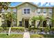 Inviting townhome exterior featuring well-maintained landscaping and charming curb appeal at 13329 Harbor Shore Ln, Winter Garden, FL 34787