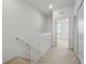 Upstairs hallway featuring white walls and access to rooms at 13329 Harbor Shore Ln, Winter Garden, FL 34787